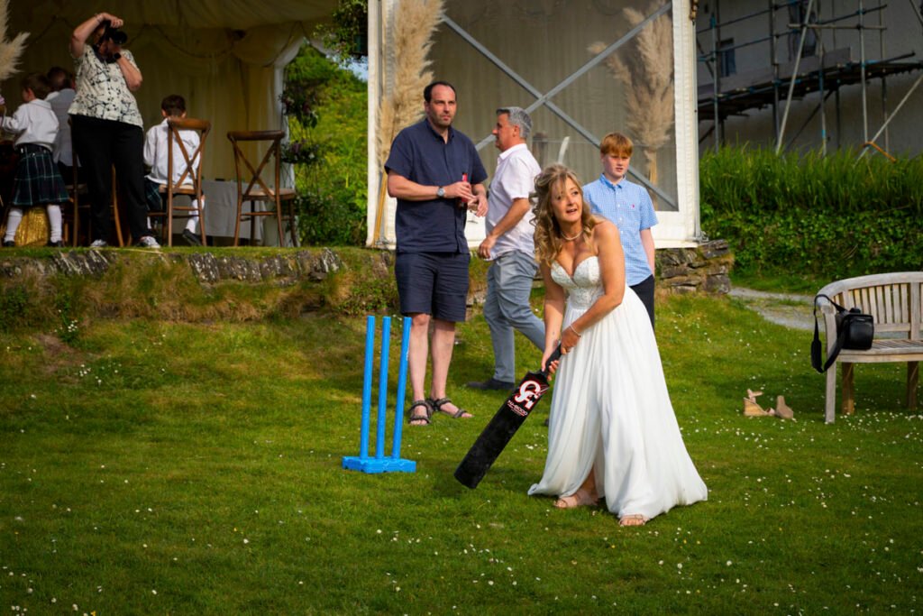 Bride playing cricket