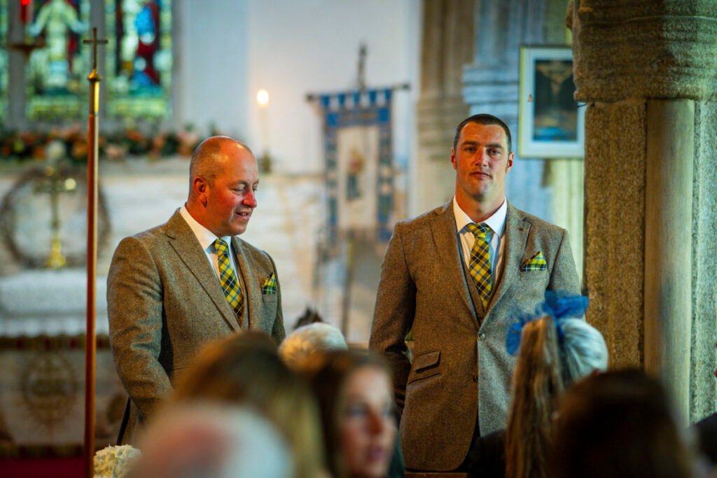 Groom and Best Man waiting for the bride in church