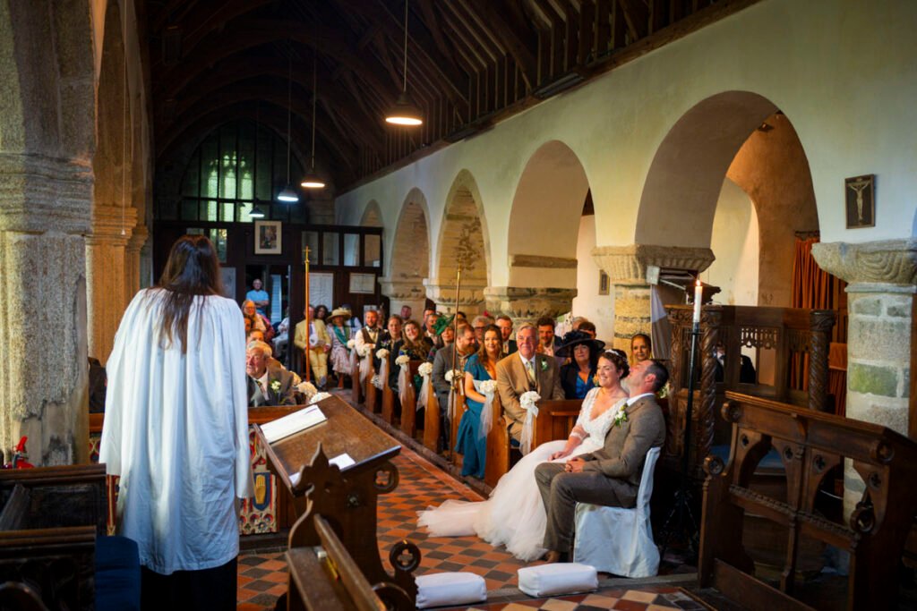 Bride and Groom listening to the sermon during the ceremony