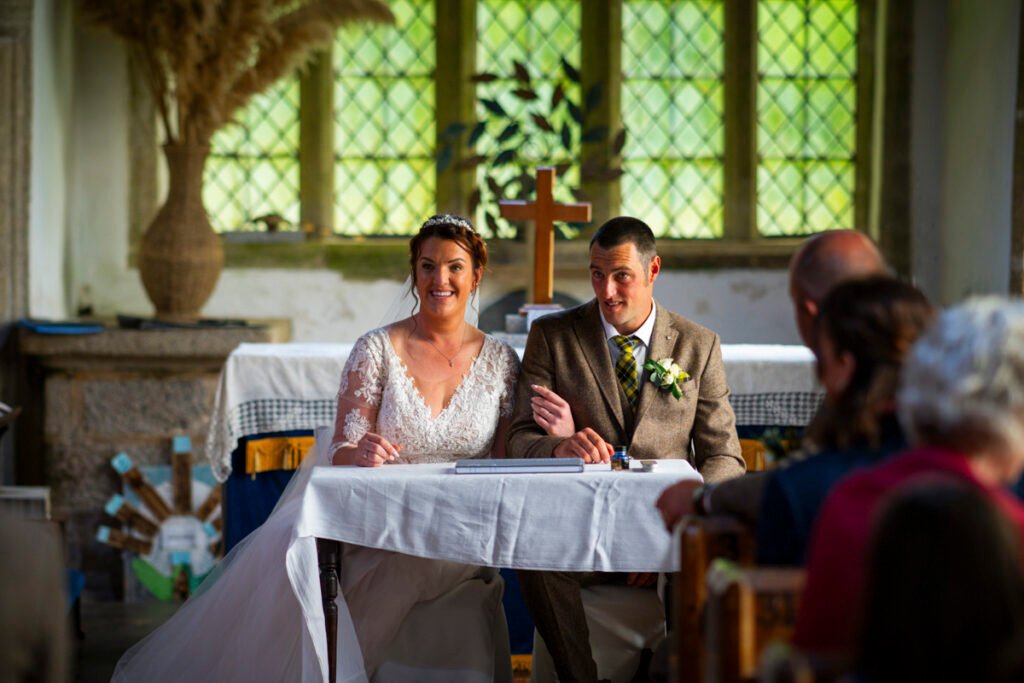Bride and Groom signing the register