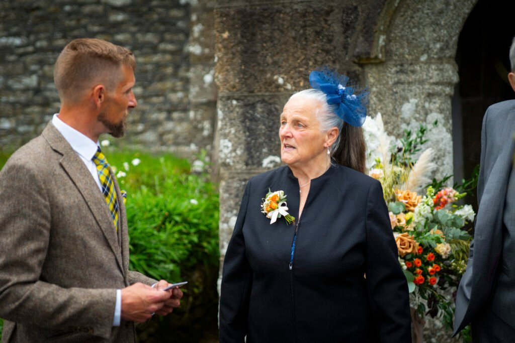 Mother of the groom outside the church