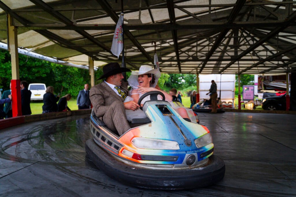 Bride and Groom on the dodgems at the wedding reception