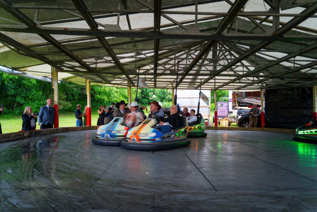 Bride and Groom on the dodgems at the wedding reception