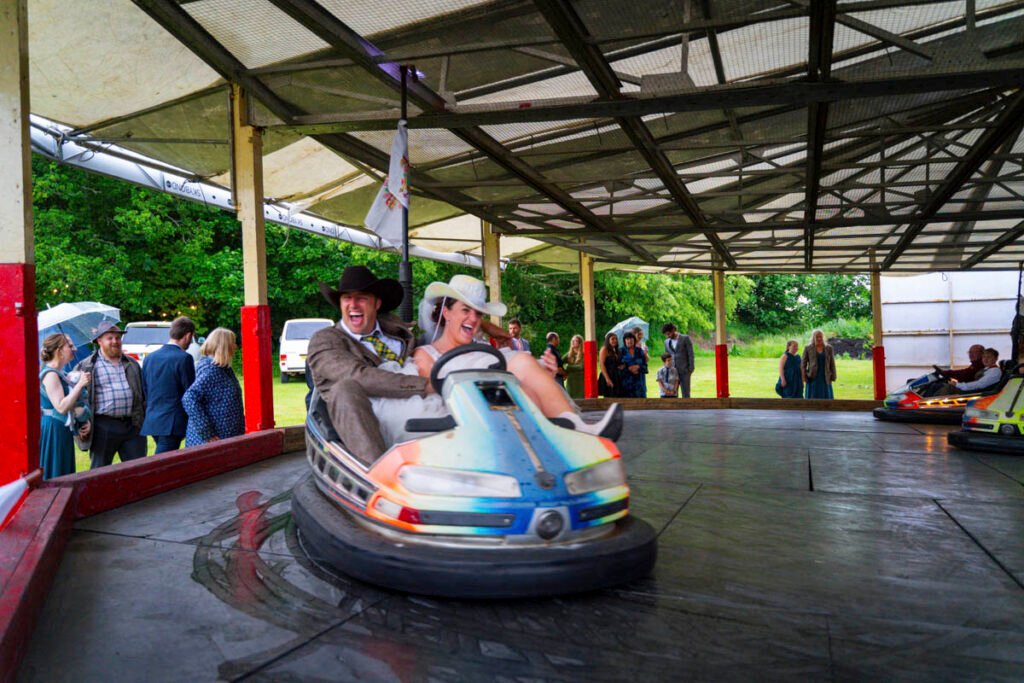 Bride and Groom on the dodgems at the wedding reception