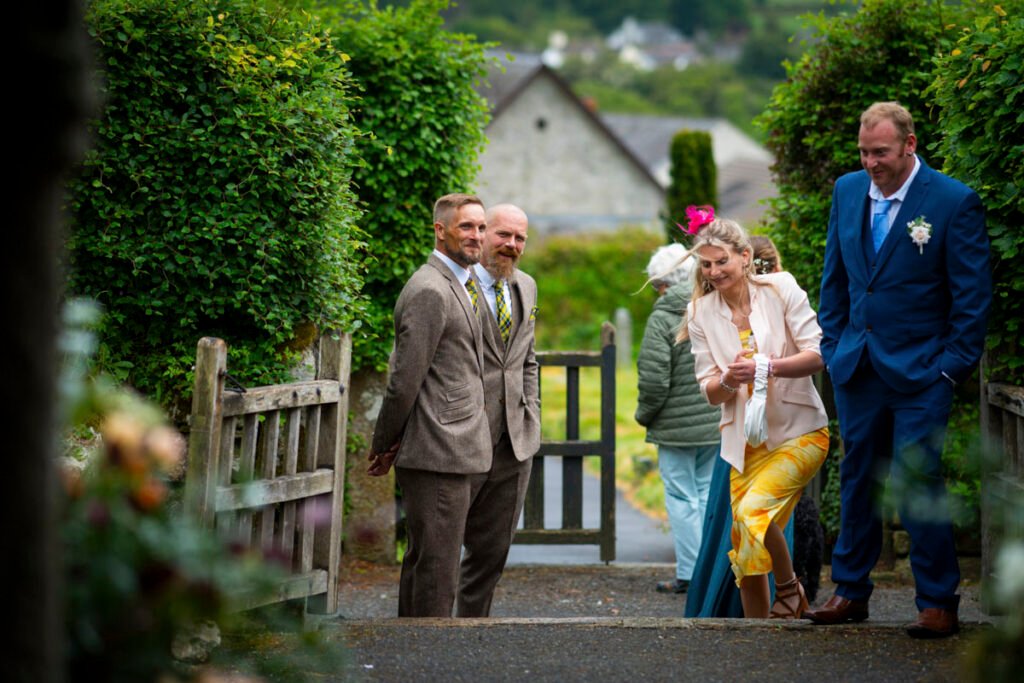 Wedding guests arriving at the church