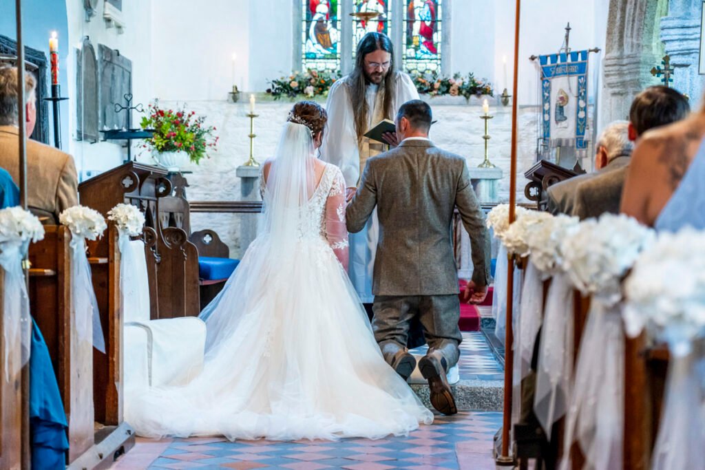 Bride and Groom kneeling in church