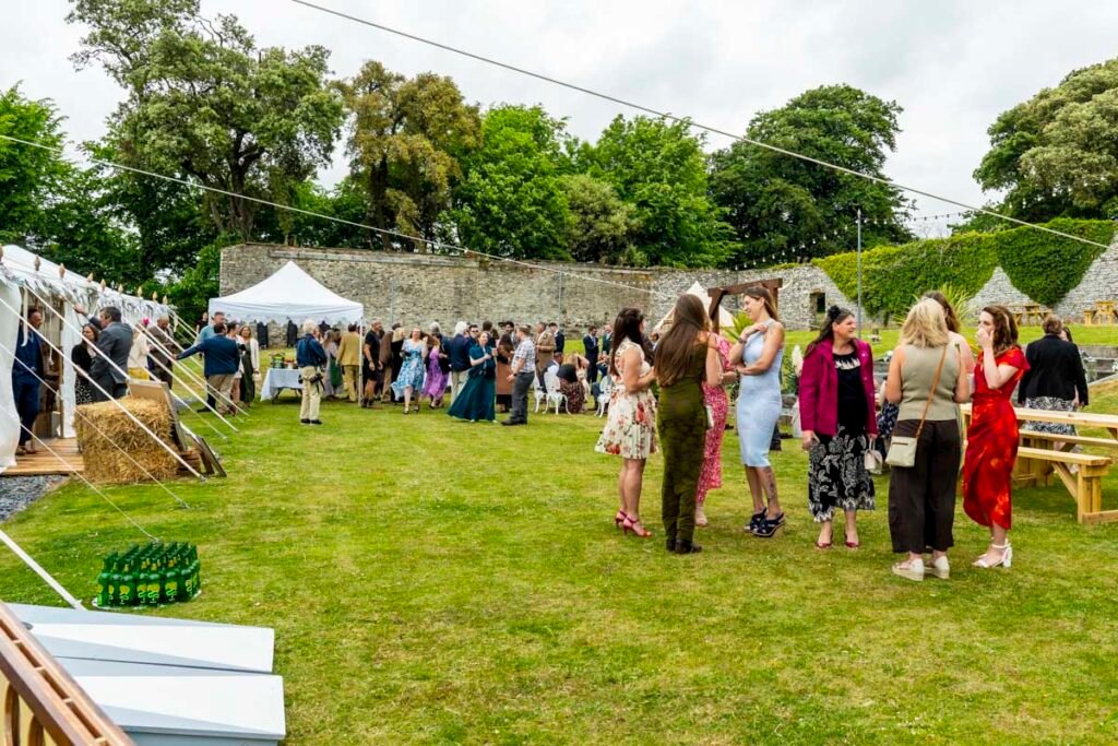 wedding guests in th garden t the reception